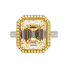 Emerald Cut Natural 7.25 Karat Fancy Light Yellow Diamant mit Rund Diamant Halo Ring