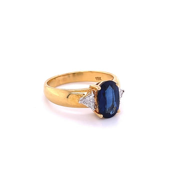 2.32 Carat Oval Cut Blue Sapphire with Trillion Cut Diamond Side stones in 18k Yellow Gold Ring – Assay Jewelers