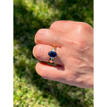 2.32 Carat Oval Cut Blue Sapphire with Trillion Cut Diamond Side stones in 18k Yellow Gold Ring – Assay Jewelers