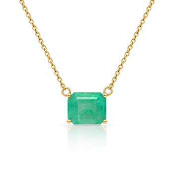 A gold chain necklace featuring a square-cut emerald-cut green gemstone pendant in a four-prong setting, displayed on a clean white background with a soft reflection below. – Assay Jewelers