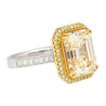 Emerald Cut Natural 7.25 Carat Fancy Light Yellow Diamond with Round Diamond Halo Ring