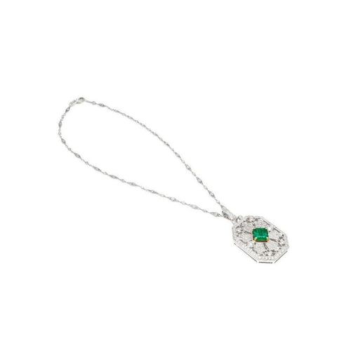 Vintage Carved Platinum 3.16 Carat Vivid Green Minor Oil Emerald Pendant with 4 CTTW in Diamonds